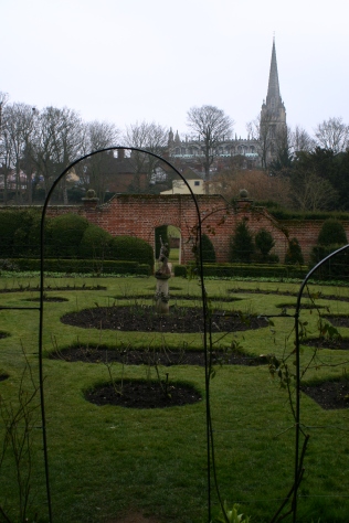 The rose garden and church beyond