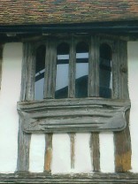 Very old wooden mullions with modern glazing